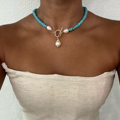 Introducing our exquisite Freshwater Pearl and Turquoise 14K Gold Filled Toggle Necklace! A harmonious fusion of timeless elegance and natural beauty. This captivating necklace brings together the iridescent allure of freshwater pearls and the vibrant charm of turquoise, creating a piece that is both luxurious and enchanting. A stunning necklace that adds a touch of sophistication to any ensemble. https://www.etsy.com/listing/1626236681/turquoise-and-freshwater-pearl-gold Dainty Pearl Necklace, Contemporary Jewelry Design, Gold Filled Necklace, Toggle Necklace, Pearl Pendant Necklace, Stunning Necklace, Bijoux Diy, Jewelry Diy, Turquoise Jewelry