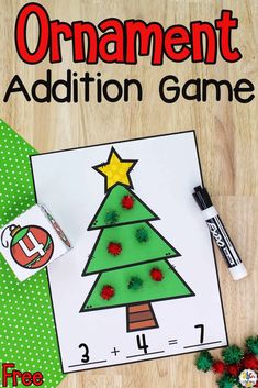 an ornament addition game with christmas tree on it and other items around it