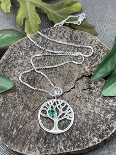 I will fabricate this Tree of Life inspired sterling silver necklace with a 6mm gemstone of your choosing in the drop down menu. A statement necklace made in sterling silver with the branches representing growth, greater knowledge and new experience in life. The diameter of the pendant portion is approximately 1.25 inches and I offer a 16 or 18 inch sterling silver box chain with a lobster clasp. I offer various gemstone selections and chain lengths in the drop down menu! Please let me know whic Sterling Silver Nature-inspired Necklace For Anniversary, Nature-inspired Sterling Silver Necklace For Anniversary, Nickel-free Spiritual Jewelry For May Birthstone, Silver Emerald Pendant Necklace As Gift, Sterling Silver Teardrop Birthstone Charm Necklace, Personalized Sterling Silver Nature-inspired Necklaces, Spiritual Sterling Silver Necklace For May Birthstone, Silver Emerald Necklace With Round Pendant As Gift, Silver Necklace For May Birthstone Anniversary