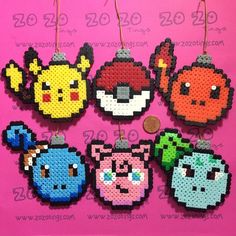 some pixelated items hanging from strings on a pink background with the words, pokemon