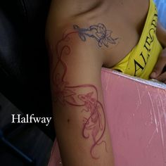 a woman with a tattoo on her arm