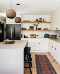 the kitchen is clean and ready to be used for cooking or eating, while also being used as a dining area