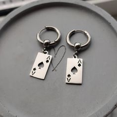 Super trendy lucky ace of spade Huggie hoop earrings in silver!♠️ Would make a great gift for any poker fan! Ear huggies and playing card charms are made of high quality stainless steel so these earrings are hypoallergenic and wont tarnish or discolour. Available as a single earring or as a pair. Hoops measure 17mm Charms measure 10x19mm Please don't hesitate to contact me with any queries or suggestions ☺️ Comes gift wrapped 🎁 Masc Earrings, Earrings Men Style, Accessory Men, Ear Huggies, Card Earrings, Mens Earrings, Men's Earrings, Earrings Men, Spade Earrings