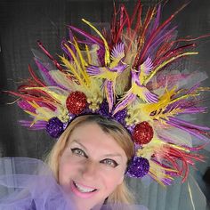 Beautiful Phoenix Fire Mardi Gras headdress could be a great addition to your fun party outfit... Decorated with sparkly twigs, sparkly balls, mesh, tulle, sequin, ..in the middle two purple, yellow,   gold embroidered Phoenix birds. Purple back side  Light weight, elastic in the back, fits most heads. Colors might look sliightly different from pictures due to your screen setting. All crowns hand made. Shipped by USPS next business day! NO refunds, NO returns, but please let me know if something wrong with your item.  Check my shop for other Holiday crowns and matching face mask. Contact me for special orders. Thank you for your interest in my design. Have fun, stay safe. Mardi Gras Headdress, Adjustable Teardrop Crown Costume Hat For Parties, Whimsical Tall Crown For Parties, Bohemian Teardrop Crown For Festivals, Adjustable Crown For Carnival Party, Whimsical High Crown Costume Hat, Adjustable Crown For Party And Carnival, Structured Crown For Carnival Party, Festive Adjustable Crown Headpiece