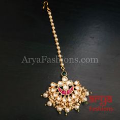 Rehana Rajwadi Kundan Ruby Mang Tika Mang Tika: Approx. 5 Inches Hook feature to tie the mang tika to hair Made in Brass with golden finish and high quality Kundan stones Lightweight Jewelry Suitable for any occasion and traditional or Modern attire Ready to ship and available for local pickup from 23059. Please message us for more details Free shipping on orders above $75 within USA. Festive Cutdana Tikka, Festive Kundan Tikka For Rituals, Festive Bollywood Style Tikka With Pallu, Bollywood Style Tikka For Rituals, Traditional Kundan Tikka With Motifs, Chandbali Cutdana Tikka For Rituals, Traditional Meenakari Tikka For Rituals, Bollywood Style Festive Tikka With Motifs, Bollywood Festive Tikka With Motifs