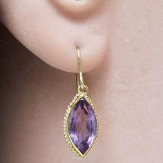 The first marquise cut was commissioned by King Louis XV, who asked a jeweler to facet a stone such that it resembled the lips of his mistress - Jean Antoinette Poisson, the Marchioness Madame de Pompadour. 14k solid gold paired with faceted amethyst stone.French backs for pierced ears. Size: 7/8 Inch. Marquise Jewelry, Lapis Earrings, Who Asked, Celebrity Engagement Rings, Cubic Zirconia Earrings, Zirconia Earrings, Pompadour, Victorian Jewelry, Amethyst Earrings