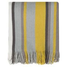 a yellow and grey striped blanket with fringes