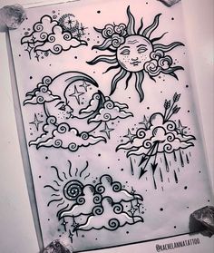 the sun and clouds are drawn in black ink on white paper with some other things