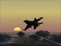 a fighter jet flying through the air at sunset