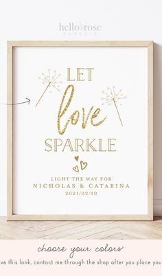 the let love sparkle sign is shown in gold foil on a white background with a wooden frame