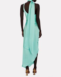 Fit for a goddess Baobab's Asaka one-shoulder satin jersey dress gracefully skims your curves with a cut-out silhouette and elongated necktie that blows in the breeze. Wear yours for beachside glam or dressed up for a night out.   Fabric: 80% nylon, 20% elastane.   Lining: 89% polyester, 11% elastane.  Concealed side zip closure.   Hand wash cold.   Imported.       Length from shoulder to hem: 51".   Model is wearing size S.  Model height 5'10", bust 31", waist 24", hips 34”. Dress Editorial, A Goddess, Satin Maxi, Satin Maxi Dress, Club Dresses, Jersey Dress, Model Height, Side Zip, Neck Tie