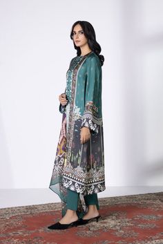 Immerse yourself in delicate illustrations in a teal satin ensemble paired with a contrasting chiffon dupatta. Product DetailUnstitched 3-Piece SHIRTDigital Printed Blended Satin Shirt 2.3MFabric: Blended SatinColour: Teal DUPATTADigital Printed Blended Tissue Dupatta 2.5MFabric: Blended TissueColour: Multi TROUSERDyed Blended Raw Silk Trouser 2.5MFabric: Blended Raw SilkColour: Teal Tissue Dupatta, Satin Suit, Chiffon Dupatta, Silk Trousers, Satin Shirt, Raw Silk, 3 Piece, Sapphire, Chiffon