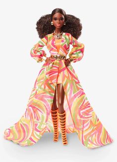 a barbie doll wearing a colorful dress and high heels