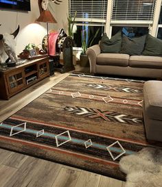 a living room filled with furniture and a large rug