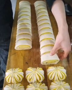 the person is making some kind of dessert on the table with it's hands