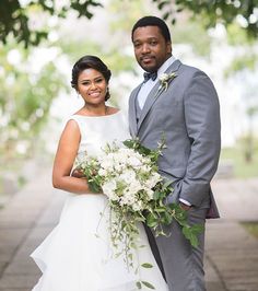 a bride and groom posing for a photo