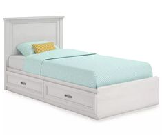 a white bed with two drawers underneath it