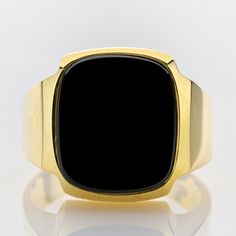 A retro gold ring, inspired by classical 1950s and 1960s gentlemens' jewelry, using solid yellow gold adorned with an onyx. Metal 14k / 0.585 gold Gemstones 1 onyx 15.5 x 13.5mm Measurements Head 17.8mm Shank 4.7mm Ring size 11 US / 64 EU Weight 11.5g Condition New General Information All items come with certificate of authenticity, gemstones have been tested at our lab if not otherwise indicated. Pendants are shown with chain for decorational reasons, please note that they do not come with a ch Timeless Black Enamel Signet Ring For Formal Occasions, Classic Black Signet Ring For Formal Occasions, Classic Black Enamel Signet Ring, Classic Gold Signet Ring With Black Enamel, Gold Signet Ring With Black Enamel For Formal Occasions, Classic Black Enamel Signet Ring For Formal Occasions, Classic Onyx Signet Ring With Polished Finish, Modern Yellow Gold Onyx Signet Ring, Classic Formal Rings With Black Enamel