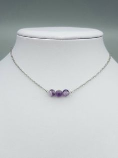 Materials: - Amethyst crystals approx 5-6mm - Stainless Steel  Please 💗 my shop to be updated on new creations : AnaDream - https://www.etsy.com/ca/shop/AnaDream IMPORTANT - PLEASE READ ✤ Necklace sizing (Exception: adjustable cord necklaces) ✤ It is very important to select the correct length when you place the order. Please make sure to measure your neck (or an older necklace you own) before purchasing and select the proper option. The seller will not be held responsible for a wrongly selecte Adjustable Minimalist Amethyst Jewelry, Dainty Silver Crystal Choker Necklace, Minimalist Silver Amethyst Jewelry, Amethyst Crystal Necklace For Healing, Purple Amethyst Choker Jewelry, Minimalist Amethyst Jewelry For Jewelry Making, Purple Amethyst Choker, Purple Sterling Silver Necklace With Adjustable Chain, Minimalist Amethyst Pendant Necklaces