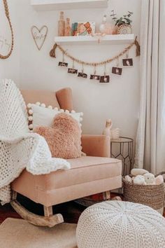 a chair and ottoman in a room with white walls, rugs and decorations on the wall