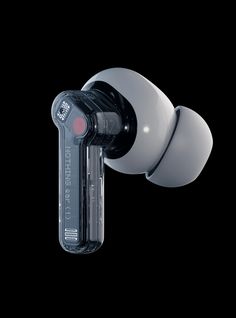 a black and white photo of a door knob with a red light on it's side