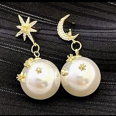 Star & Moon Post Earrings With Pearl Drops. The Pearl Drips Also Have Gold Moons And Stars On The Pearls With Gold & Clear Stones. I Have 2 Pairs Of These. They Are Brand New. Very Pretty! White Party Jewelry With Moon Charm, White Moon Charm Party Jewelry, White Moon Charm Jewelry For Party, Celestial White Round Earrings, Elegant White Earrings With Moon Charm, White Celestial Round Earrings, White Celestial Earrings With Moon Charm, Celestial White Star Earrings, White Celestial Star Earrings