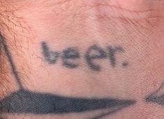 a close up of a person's neck with the word peep written on it