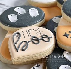 decorated cookies are arranged on top of each other