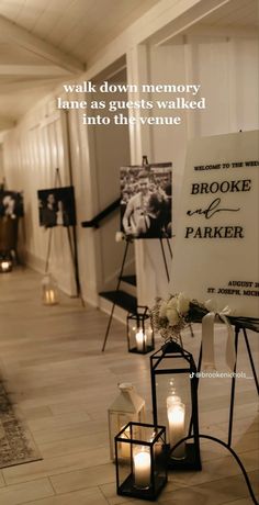 a sign with candles in front of it that says, walk down memory lane as guests walked into the venue