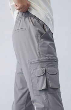 Casual meets cool with the new Eco Stretch Gray Slim Cargo Pants from PacSun. This go-to pair is designed with an elastic stretch waistline, adjustable drawstrings, side pockets, zip cargo pockets, a drawcord hem, and a slim fit.

Learn more about PacSun eco items Slim Cargo Pants, Street Fashion Men Streetwear, Guys Clothing Styles, Man Style, Mens Streetwear, Pacsun, Cargo Pants, Slim Fit, Street Style