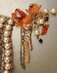 "A beautiful necklace consisting of faux pearls clear Lucite beads ,mother of pearl orange chips , a pink lucite flower an agate piece, all hanging from silver tone chains creating a sculpturesque decorative design as you can see from the pictures. It is in great vintage condition without any problems and measures 16 inches long and each pearl is 1/4\" inches wide. A beautiful large faux pearls and gold tone wedding day special bridal necklace !" Elegant Coral Necklaces For Parties, Vintage Peach Necklace As A Gift, Vintage Peach Necklace As Gift, Vintage Peach Necklace For Gift, Gold Tone Wedding, Seashell Pendants, Flower Agate, Decorative Design, Star Wedding