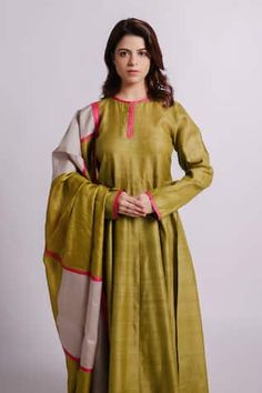 Green full sleeves solid wild silk anarkali with pink patti stitched on neckline and sleeves. Paired with a pencil pant with detailing of tucks and a green colour block wild silk dupatta. - Aza Fashions Long Sleeve Slub Silk Dress With Zari Work, Long Sleeve Slub Silk Dress With Resham Embroidery, Pink Long Sleeve Raw Silk Anarkali Set, Navratri Long Sleeve Churidar In Slub Silk, Silk Anarkali Set With Resham Embroidery And Long Sleeves, Silk Long Sleeve Anarkali Set With Resham Embroidery, Long Sleeve Dress In Slub Silk With Zari Work, Pista Green Long Sleeve Silk Kurta, Diwali Long Sleeve Cotton Silk Anarkali Set