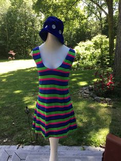 "This is one funky little mini from the 70's. The fabric is a poly/jersey blend and the design is bold colored stripes...hot pink, lime green and royal blue. Scoop necked with zipper down back. It could be worn as a mini dress or as a fun top with leggings. Hand made many years ago, still in nice wearable shape. Measurements: 36\" bust; mid body 33\"; 38\" hips; 51\" hemline; 32 1/2\" tall. Thanks for stopping by my Etsy shop!" Retro Multicolor Mini Dress, Multicolor Mini Dress With Retro Print, Retro Striped Mini Dress, Sleeveless Multicolor Retro Print Mini Dress, Pink And Royal Blue, Fitted 1970s Mini Dress, Striped Mini Dress, Little Dresses, Nice Tops