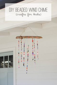 a wind chime hanging from the side of a house with text overlay that reads diy beaded wind chime crafts for kids