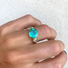 Item Details: 2.43 ct. natural Colombian Emerald vibrant light green color. Six round brilliant-cut diamonds weighing 0.06 ct (F/VS) Two trillion-shaped diamonds weighing 0.82 ct. (E/VS) Set in 18K yellow gold This ring is made with a one-of-a-kind center stone. To create a similar ring email custom@berlingerrings.com. Enquire about this ring Design a custom piece with us Trillion Diamond Ring, Trillion Diamonds, Columbian Emeralds, Ring Inspo, Plastic Ring, Colombian Emeralds, Tourmaline Necklace, Band Engagement Ring, Emerald Jewelry