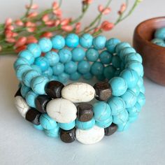 Turquoise Love Bracelet, Meditation Yoga Bracelet, Spiritual Energy Healing, Mala Beads Chakra Bracelet, Visualization Bracelet, True Healing Source This chunky turquoise (magnesite) Universal Love bracelet is handmade with 10mm turquoise magnesite stones, white magnesite stones and dark brown wood beads on elastic cord.  This listing is for one bracelet. CHOOSING YOUR BRACELET SIZE: For a comfortable fit I recommend choosing the size bracelet that is about 1/2 inch larger than your actual wrist Turquoise Howlite Beaded Bracelets As A Gift, Turquoise Bangle With Natural Stones, Turquoise Bangle Beaded Bracelets With Natural Stones, Turquoise Beaded Bangle With Natural Stones, Turquoise Howlite Beaded Bracelets, Turquoise Beaded Howlite Bracelets, Bohemian Turquoise Crystal Bracelet With Spacer Beads, Bohemian Turquoise Stretch Bracelet With Spacer Beads, Bohemian Turquoise Howlite Bracelets