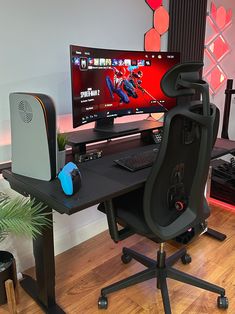 a computer desk with a monitor, keyboard and mouse sitting on it's side