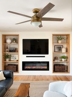 the living room is clean and ready to be used as a media room for entertainment