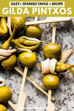 green olives on skewers with text overlay that reads easy spanish tapas recipe