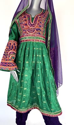 Afghani Dress Traditional Afghan Dress With beautiful high quality Banarasi fabric- Kuchi Dress Green and Purple Multicolor (US based Seller) This dress is perfect and light. Note: The Dress will ship from California, USA within 3 business days Please follow us on instagram @baranaboutiquellc Size: S/M US with adjustable belt (Bust 39 inch Dress Length 42 inch) Afghan Dress Handmade with love and care with traditional Afghani style Dress Afghan Clothes Tribal Kuchi Dress These Afghan clothes are Semi-stitched Banarasi Silk Dress With Pallu, Festive Bollywood Dress With Traditional Patterns, Bollywood Ceremonial Transitional Dresses, Traditional Semi-stitched Jamawar Gown, Traditional Jamawar Gown With Resham Embroidery, Ceremonial Zari Work Dresses For Navratri, Bollywood Style Ceremonial Dresses For Transitional Seasons, Bollywood Dress With Traditional Patterns And Drape, Green Dresses With Intricate Embroidery And Traditional Drape