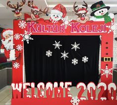 a welcome sign with christmas decorations on it