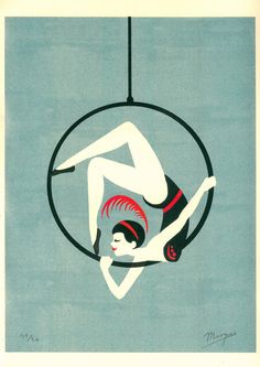 a woman is hanging upside down on a hoop