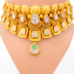 This choker set is a masterpiece in 22k gold with an antique finish, weighing a substantial 80.4 grams. It features timeless Kundan stones and is designed with a length of 13.5 inches and a width of 1.5 inches, creating a striking profile. The necklace includes a 0.75-inch drop, enhancing its traditional appeal, and comes with 1 inch of adjustable links secured by a hook lock for a perfect fit. Matching earrings, each 2.25 inches in length with secure screw-back posts, complete the ensemble. Thi Gold Choker Set, Choker Set, Gold Choker, A Hook, Antique Finish, 22k Gold, Matching Earrings, 1 Inch, Screw