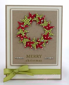 a christmas card with red and green bows