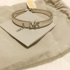 Nwt Silver Michael Kors Logo Bangle Bracelet Mk Jewellers, Mk Bracelet, Michael Kors Bracelet, Michael Kors Jewelry, Stone Bangle, Diamond Jewelry Designs, Silver Charm Bracelet, Jewelry Essentials, Star Bracelet