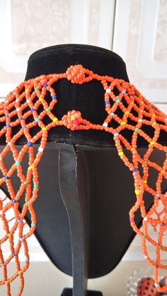 African Beaded wedding necklace, Zulu Cape necklace, Beaded shawl necklace, Christmas gift for her, Women jewelry, Bridesmaid gift This beaded bib necklace is superbly crafted which can be worn with any outfit at different occasions and it will absolutely makes you stand out. Main color - orange. The necklace can be available in different colors. Wholesale available at a fair price,please contact me. For any clarification,please send me a convo or an e-mail. Thank you for visiting and happy shop Bohemian Beaded Bib Necklace For Wedding, Bohemian Bib Necklace For Wedding, Traditional Beaded Bib Necklace For Party, Orange Beaded Necklaces With Dangling Beads For Gift, Traditional Colorful Beads Bib Necklace For Party, Traditional Bib Necklace With Colorful Beads For Parties, Bohemian Beaded Necklaces With Dangling Beads For Weddings, Bohemian Beaded Necklace With Dangling Beads For Wedding, Beaded Bridal Necklace Gift