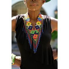 This beautiful beaded bold and authentic colored necklace is handmade by the Maasai women. We directly work with Maasai artisans to produce and market high-end beaded jewelry based on traditional beading techniques infused with modern aesthetics. Maasai women are skilled artisans who are world wide known for their use of colorful glass beads. Maasai culture is highly patriarchal and it is the women who are hurt the most by issues of structural inequality. With us working directly with them, they Maasai Culture, Plain Tee Shirts, Colored Necklace, Plain Tees, Beading Techniques, Maasai, Evening Outfits, Textile Jewelry, Colourful Necklace