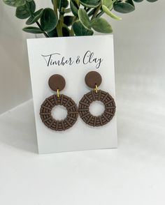 These earrings are a beautiful brown color with a rattan design. They are very lightweight and comfortable to wear all day! Add a subtle statement to your look with these Round Rattan Dangles. Handcrafted with lightweight polymer clay, the round shape ensures a perfect fit with any outfit. Hypoallergenic and high quality materials. The earring cards are 3” tall and 2.5” wide for size reference. Handmade Brown Hoop Earrings For Everyday Wear, Everyday Handmade Brown Hoop Earrings, Earthy Brown Drop Earrings, Trendy Brown Circular Earrings, Trendy Brown Circle Earrings, Elegant Brown Earrings For Beach, Elegant Brown Earrings For The Beach, Elegant Brown Beach Earrings, Brown Drop Earrings For Beach