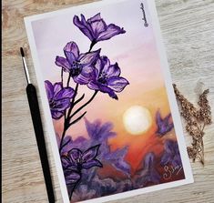 a painting of purple flowers with the sun setting in the background and a brush next to it