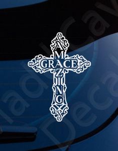 a car with the word grace on it and a cross sticker in front of it